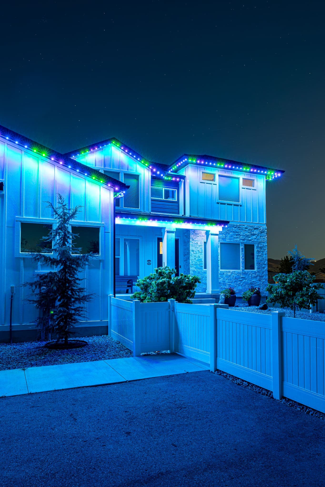 A roofline lit in bold blue.