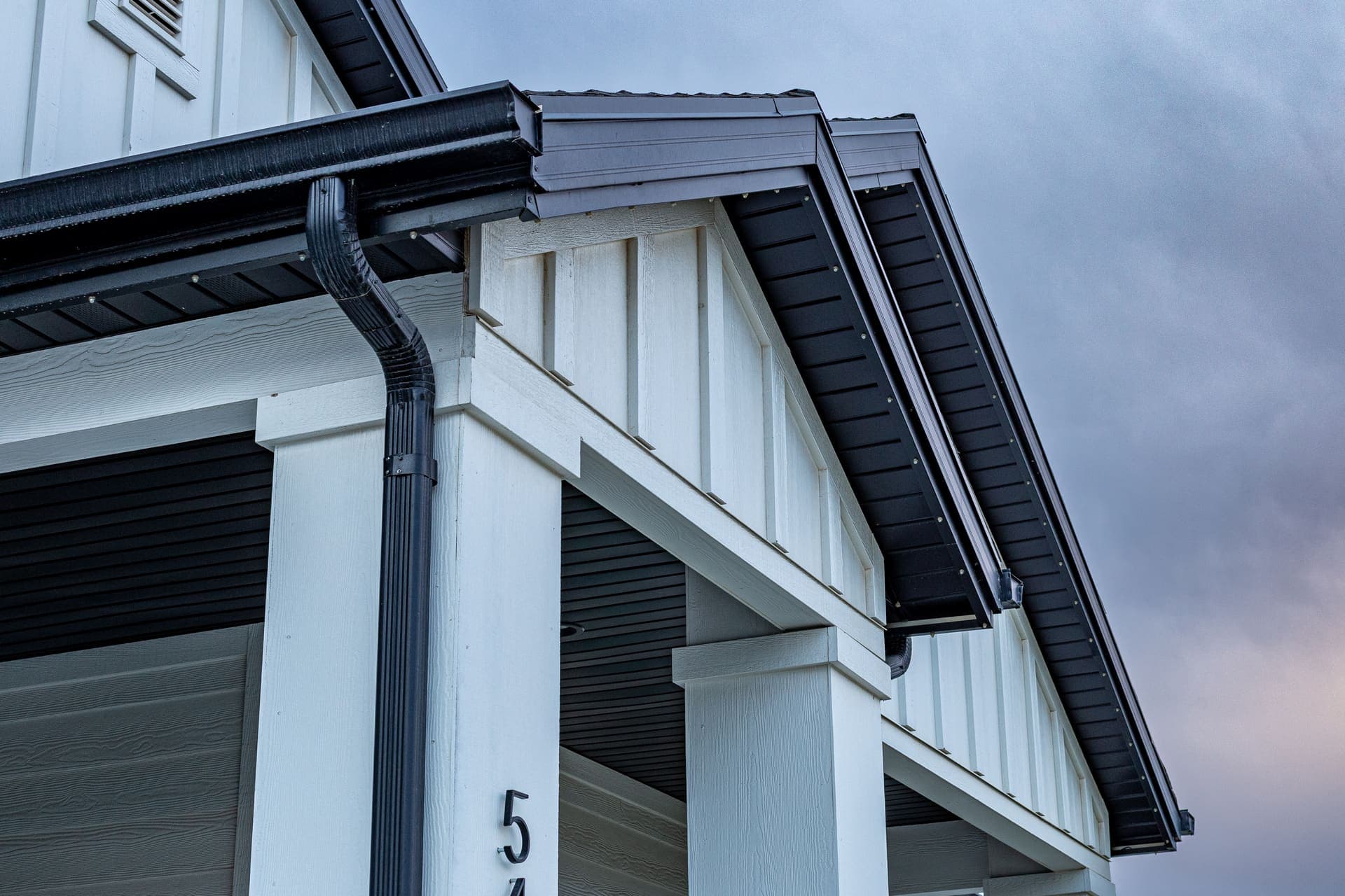 Close view of the color-matched channel blending into a home's fascia.